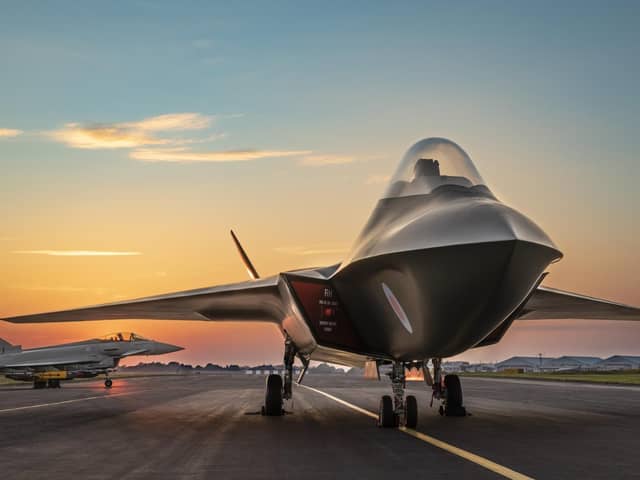The full sized mock-up of the Tempest with a Typhoon on the runway behind it.