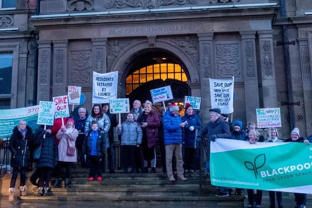 Residents protesting against the golf course plans outside the Town Hall