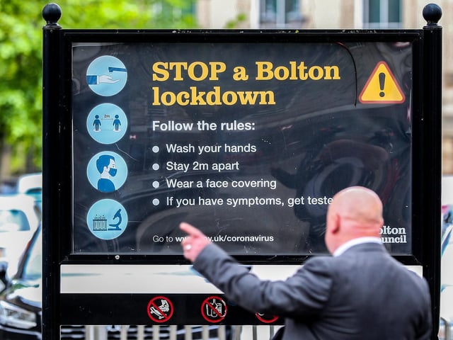 Coronavirus signage in Bolton town centre, one of the areas of the UK where the Covid variant first identified in India is spreading fastest