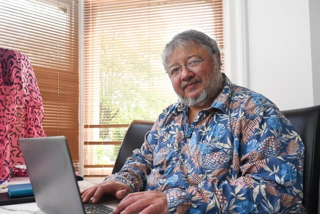 Author David Menon working at his home in St Annes
