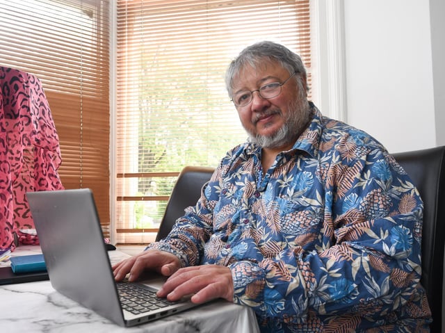 Author David Menon working at his home in St Annes