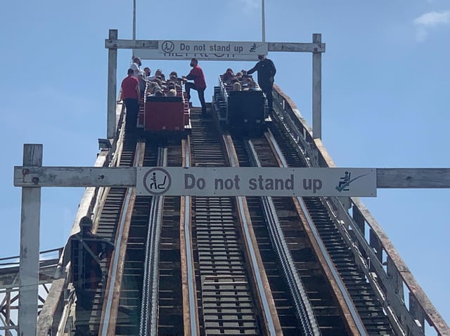 Visitors are helped down from the Grand National rollercoaster ride at Blackpool Pleasure Beach.