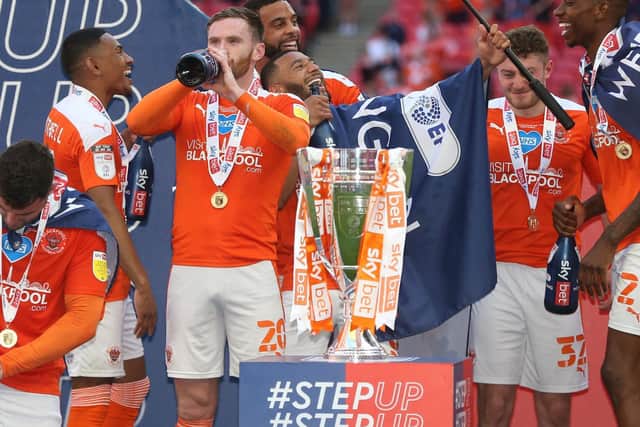 Blackpool players celebrating promotion to the Championship