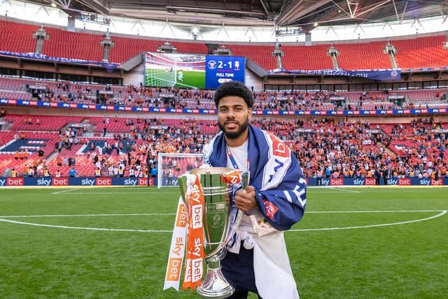 Simms with the League One play-off final trophy