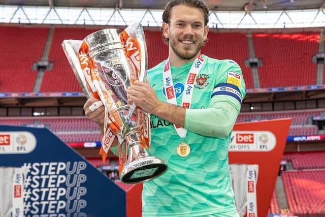 Maxwell lifted the League One play-off final trophy at Wembley on Sunday