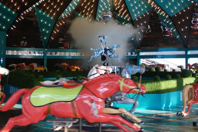 The Derby Racer is a huge carousel made up of 56 horses arranged in four rows. As the ride rotates the horses move up and down, simulating an action packed race.