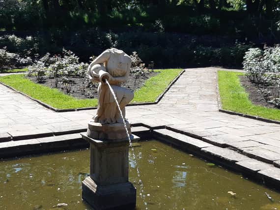 The damaged statue in Ashton Gardens