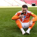 Turton on the hallowed Wembley pitch after helping Pool win promotion