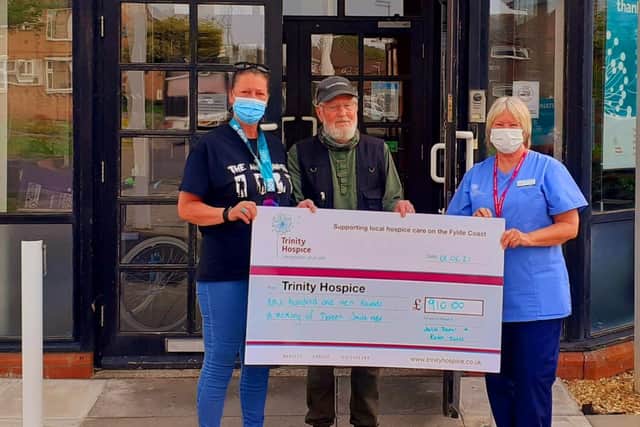 Julie Dean and her dad Peter Smith present Trinity Hospice with £910, after Julie ran 500km in memory of her mum Doreen Smith MBE. Photo: Julie Dean