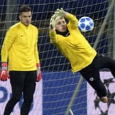 Daniel Grimshaw warms up for Man City as Ederson watches on