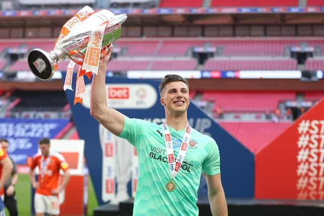 Moore with the League One play-off final trophy