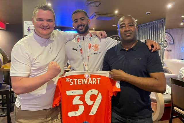 Kevin Stewart (centre) celebrates Blackpool's Wembley triumph with his father (right) and entrepreneur Samuel Leeds