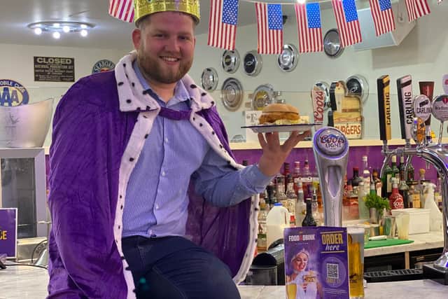 Manager Kieran Dixon, who is dad to daughters Masie, eight, and Eve, posing as a king at Viva Vegas Diner in Blackpool