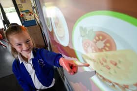 Gateway Academy pupil Abbie French-Hallsworth with the new Cypad touch-screen system, which has been introduced to allow children to independently choose their meals in advance. Picture: Daniel Martino/JPI Media