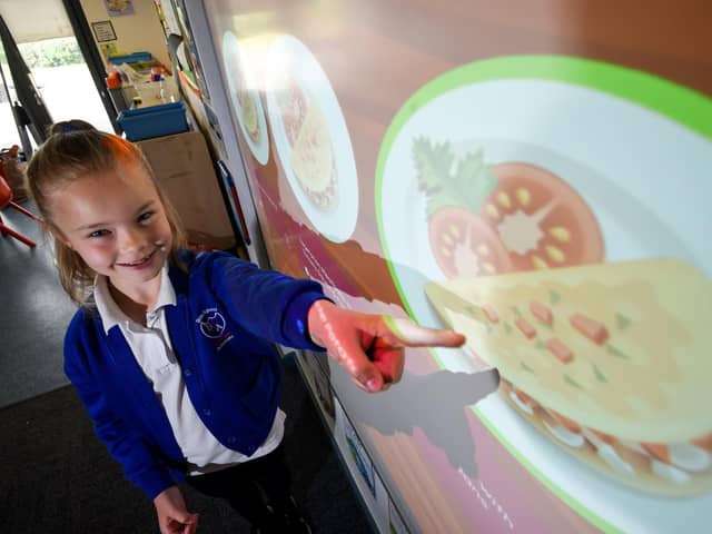 Gateway Academy pupil Abbie French-Hallsworth with the new Cypad touch-screen system, which has been introduced to allow children to independently choose their meals in advance. Picture: Daniel Martino/JPI Media