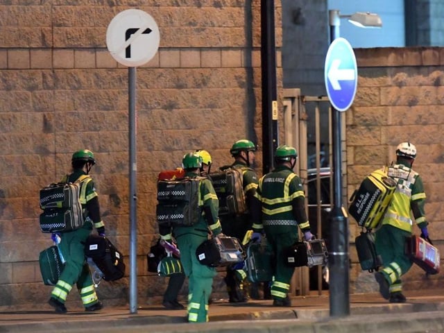 Medics deploy at the scene of a reported explosion during a concert in Manchester, England on May 23, 2017