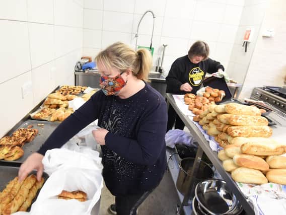 Volunteers prepare food at Amazing Graze