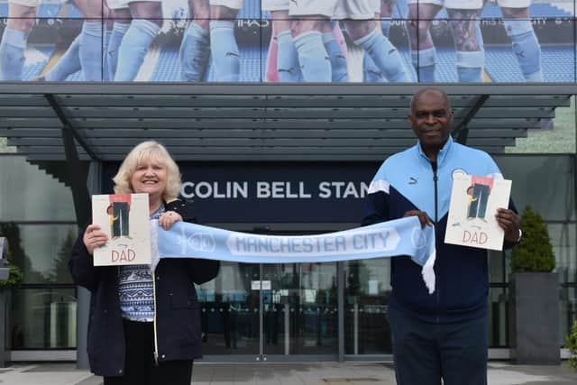 Author Susan Quinn with Manchester City ex-goalie Alex Williams MBE - and her late dad's beloved team scarf - outside the Etihad Stadium.