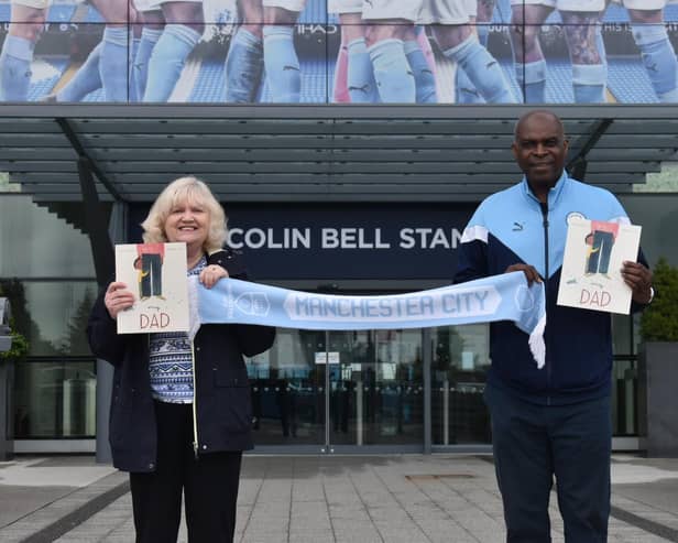 Author Susan Quinn with Manchester City ex-goalie Alex Williams MBE - and her late dad's beloved team scarf - outside the Etihad Stadium.