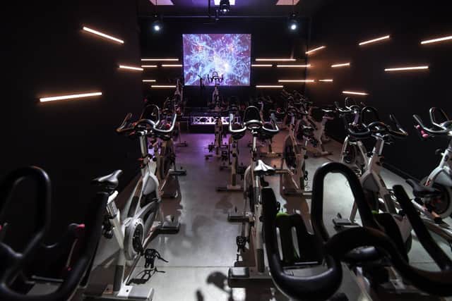 The spinning classes, say the owners, are like being on a healthy night out, with 
nightclub style lights and music