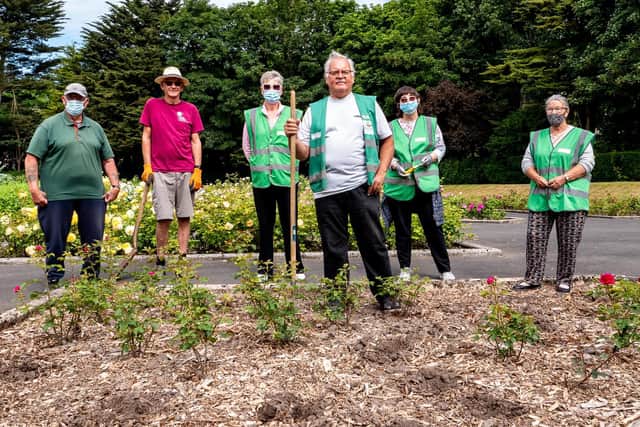 Alan Wignall,  Rose Garden volunteers team leader, with (from left) Terry Harrison, Terry Wallis, Diane Glister, Sue Osborne and Pam Harrison, at one of the beds stripped of roses.