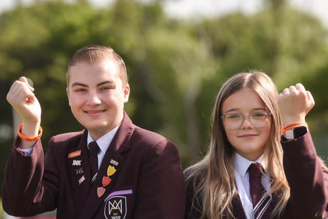Matthew Corsbie and Olivia Whitewood with their anti-bullying wristbands. Picture: Dan Martino/JPI Media