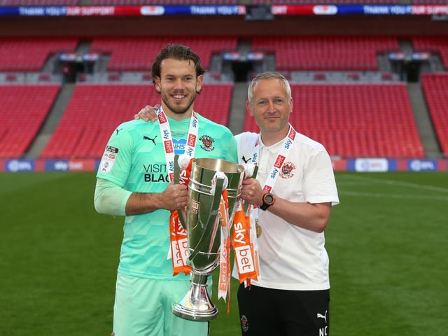 Neil Critchley and Chris Maxwell celebrate Blackpool's promotion