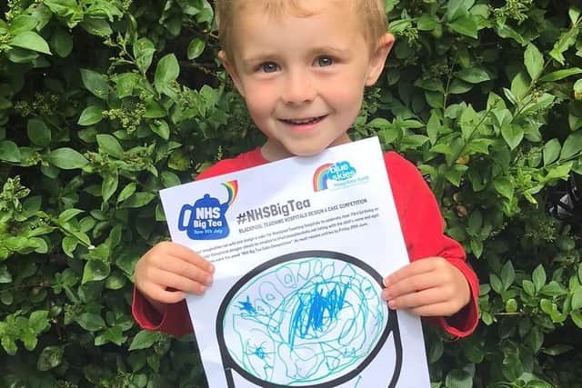 One of Blue Skies' fundraisers George Lonsdale, four, with his birthday cake design ahead of the NHS' 73rd birthday celebrations.
