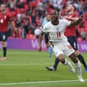 Raheem Sterling celebrates his early goal which settled the match against the Czech Republic