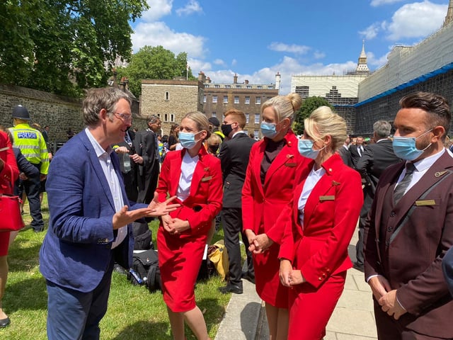 Blackpool North and Cleveleys MP Paul Maynard talks to members of the travel industry at Westminster as a protest over the Government's traffic light travel system takes place