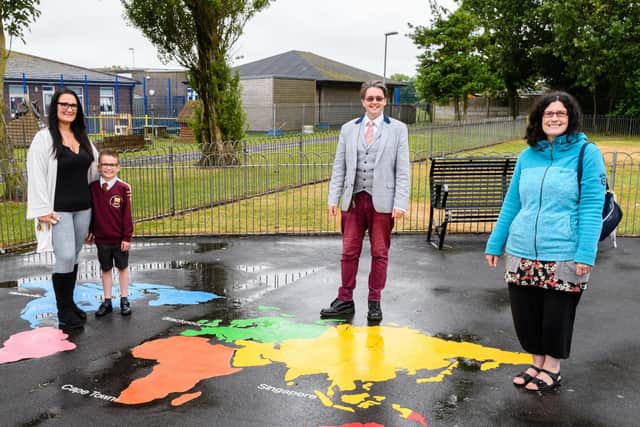 Samantha and Riley-Jay Hindmarch, Paul Galley and Michelle Backhouse with some of the artwork installed in East Pines Park