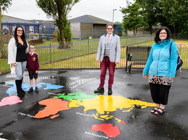 Samantha and Riley-Jay Hindmarch, Paul Galley and Michelle Backhouse with some of the artwork installed in East Pines Park