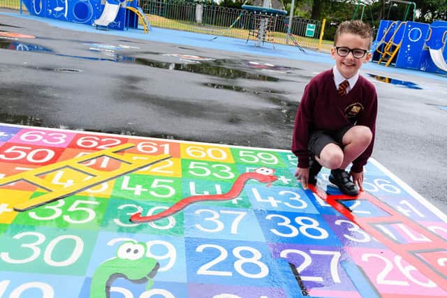 Riley-Jay with the new snakes and ladders