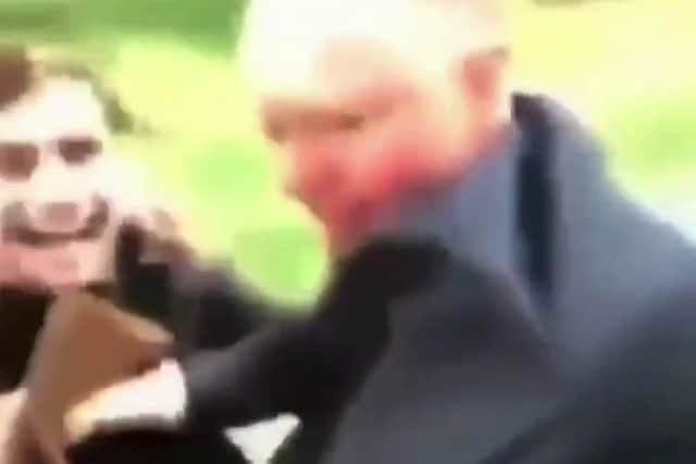 A still from the footage which appears to show England’s chief medical officer Professor Chris Whitty being harassed by two men in a park.