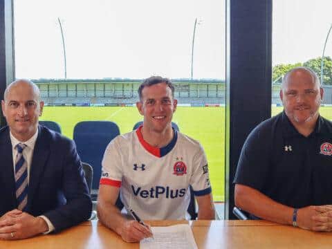 Luke Joyce is welcomed to AFC Fylde by manager Jim Bentley (right) and chief executive Jonty Castle