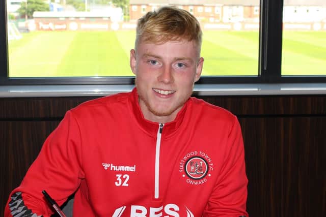 Paddy Lane signs his two-year Fleetwood contract