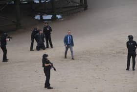 Taking centre stage on the beach near Central Pier was actor James Nesbitt, in the role ofa homicide detective, as 'armed police' surroundeda suspect with their guns drawn