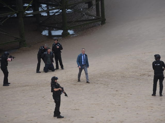 Taking centre stage on the beach near Central Pier was actor James Nesbitt, in the role ofa homicide detective, as 'armed police' surroundeda suspect with their guns drawn