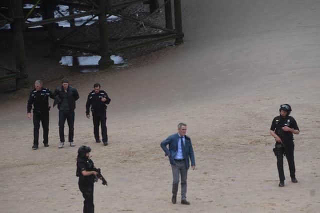 Taking centre stage on the seafrontwas James Nesbitt, in the role ofa homicide detective, as 'armed police' frantically surroundeda suspectwith their guns drawn