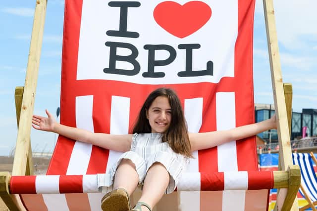 Andrew's daughter Isabelle Beaumont (11) relaxes in a giant deckchair on Blackpool beach. Photo: Kelvin Stuttard