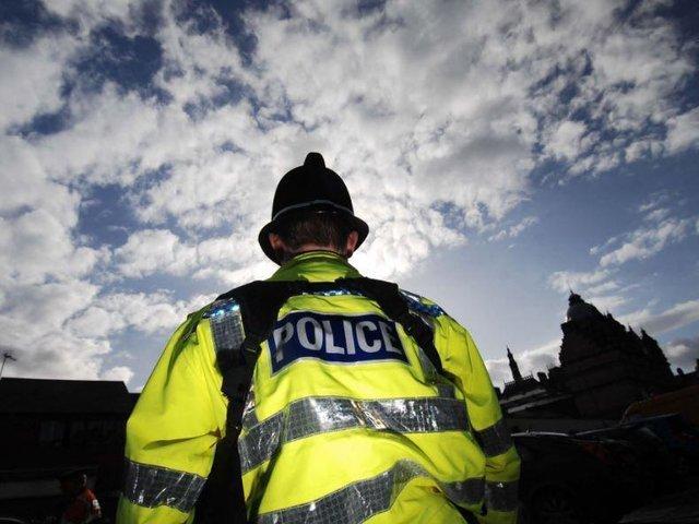 Police officers who rescued a woman from an armed man in Blackpool have been praised in the House of Commons.