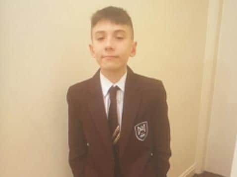 Frankie Lewis, 13, is described as being around 5'2" tall and of skinny build. He has mousey brown hair and was last seen wearing a black jacket and bottoms. Pic: Lancashire Police