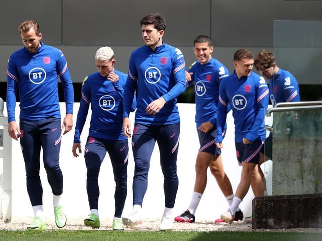 Harry Kane, Phil Foden and Harry Maguire of England and teammates take to the field during the England Training Session at St George's Park on July 05