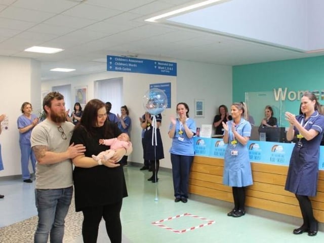 Kathrine, Stuart and Ruby Dawson of Garstang leave Blackpool Victoria Hospital last year with a guard of honour after Covid-19 battle