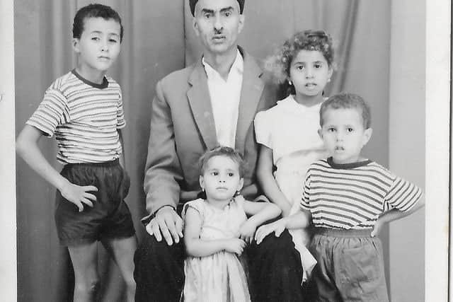 A young Hasan (left) with his father, siblings and cousins in Benghazi, Libya,  during the early 1960s.