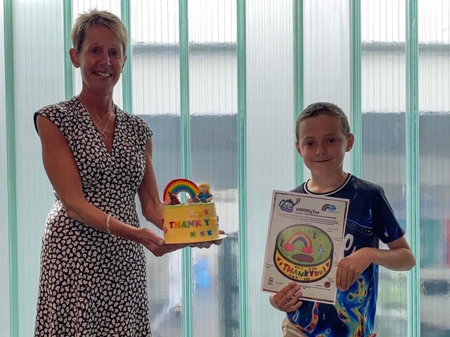 Deputy chief executive Nicki Latham with Thomas Ryan and his birthday cake design. Pic: Blue Skies