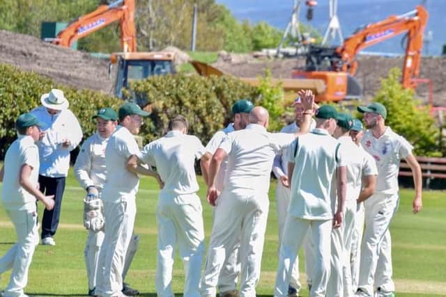Kirkham and Wesham celebrate another wicket as the Fylde's leading Palace Shield club