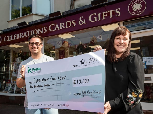 Sarah Mangan of Celebrations Cards and Gifts is presented with the grant money by Coun Michael Sayward outside the Lytham shop