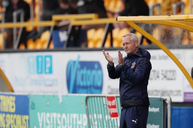 Neil Critchley applauds the Blackpool fans prior to kick-off