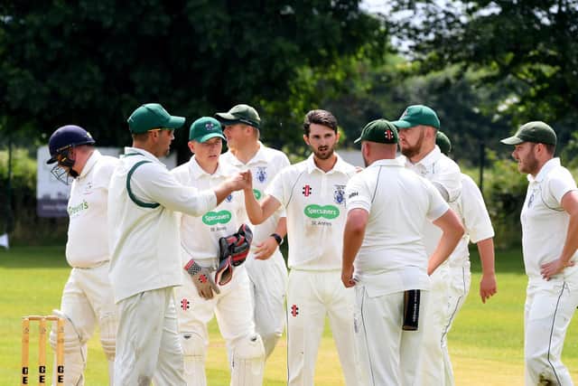 Kirkham and Wesham celebrate a wicket in their Palace Shield victory at Great Eccleston